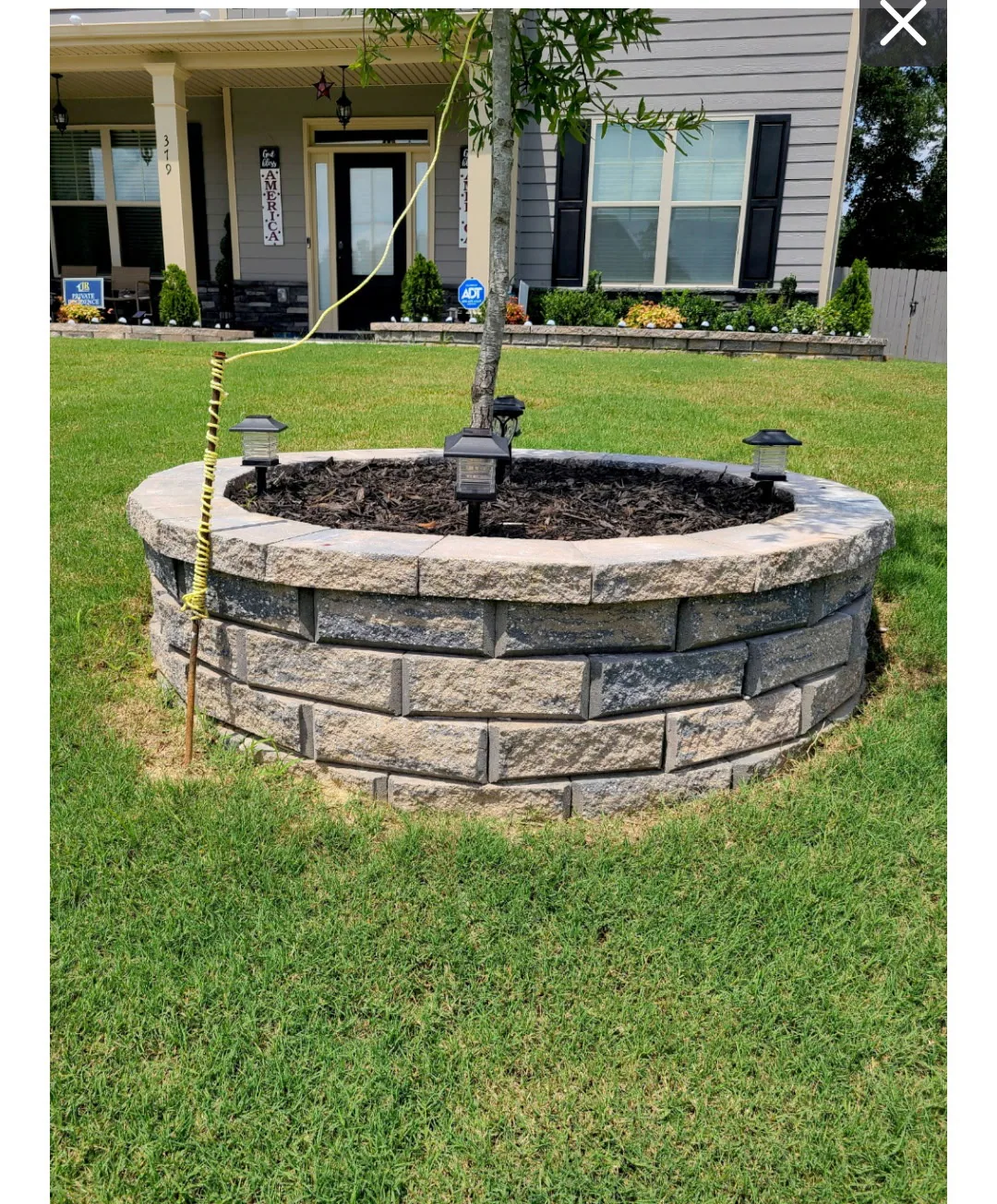Stone tree ring installed by E&D Landscaping